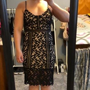 Black mid length lace dress.